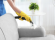 Person vacuuming couch
